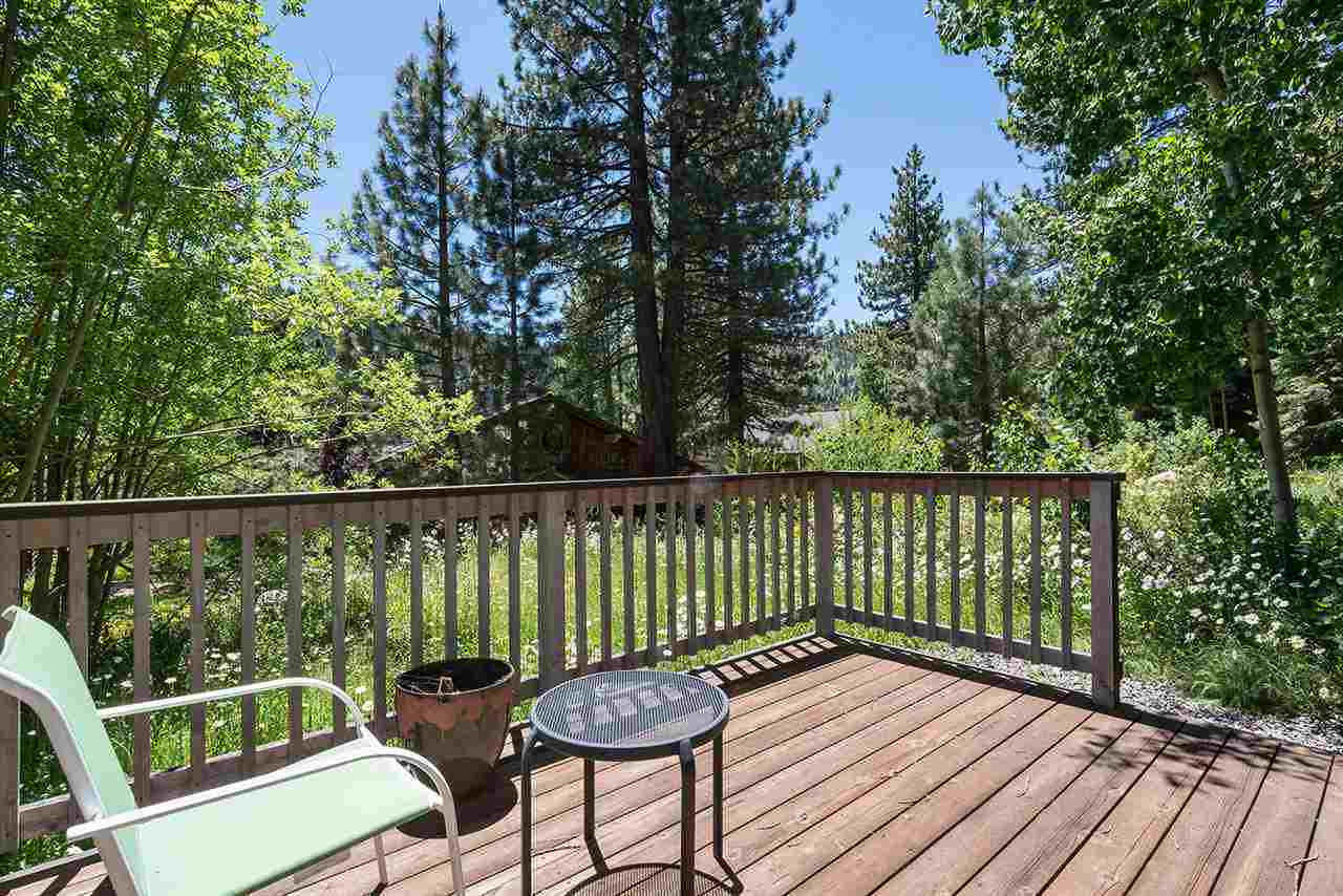 Private deck with forest and meadow views at the Palisades Tahoe Studio in Olympic Valley